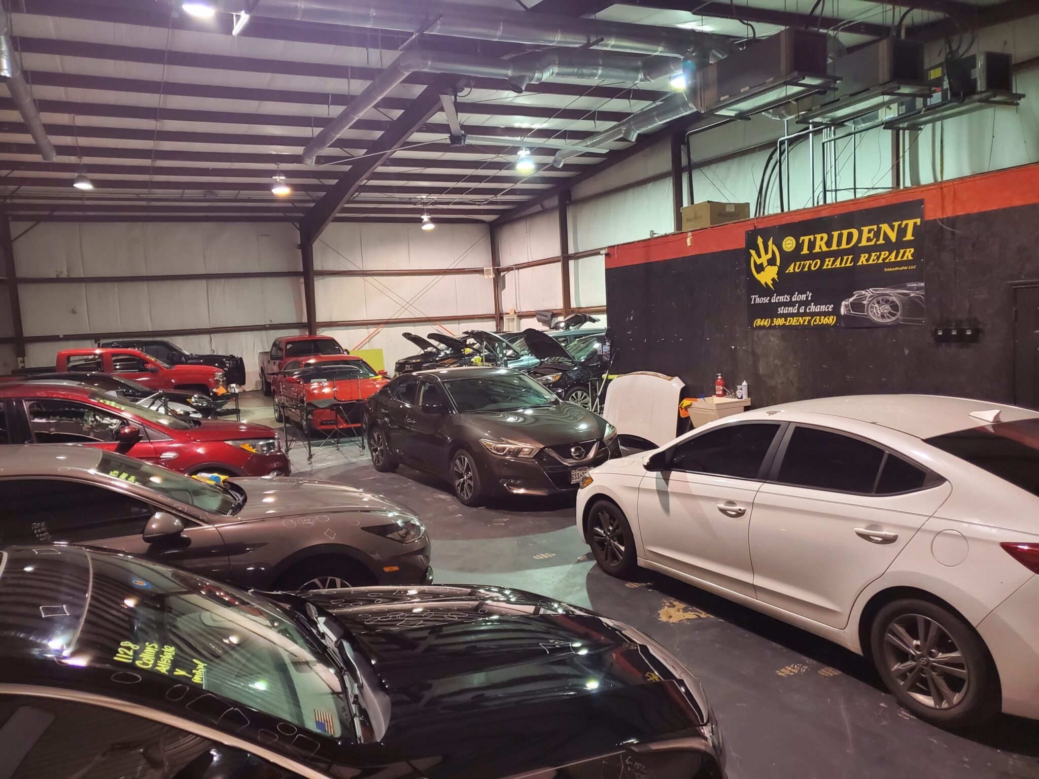 Cars waiting for hail repair at Trident Killeen