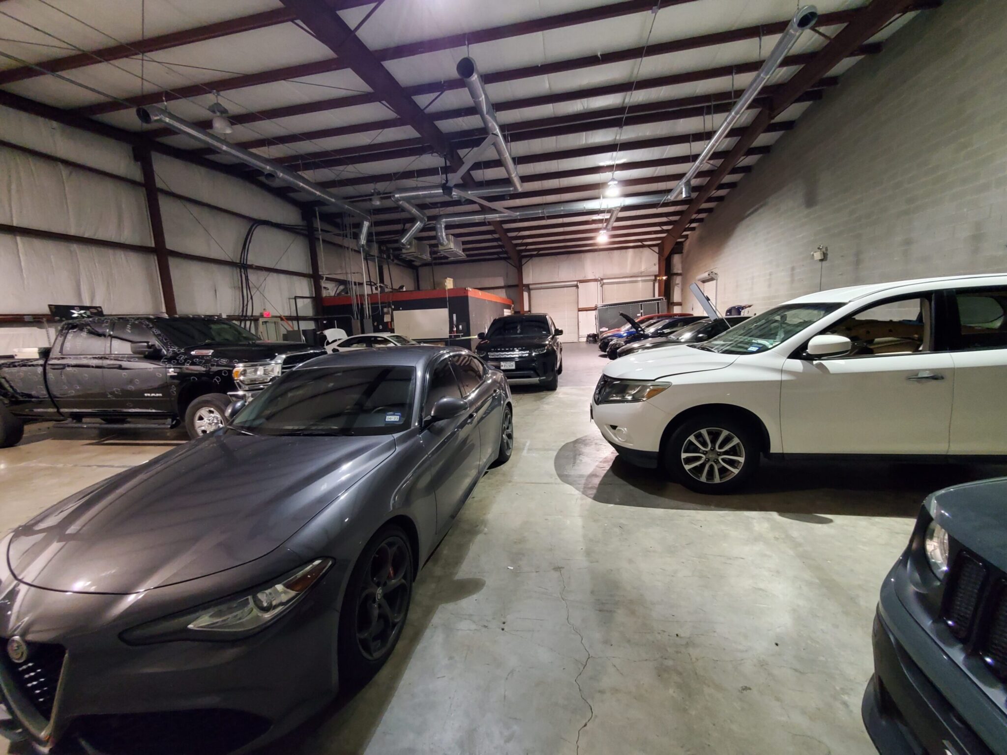 Killeen hail repair shop floor with vehicles in for paintless dent repair